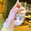 Detail of Hello Kitty liquid glitter keychain in strawberry shape with pink strap - Strawberry Milk White Kt