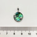 Close-up of a silver moon and star pendant with shell inlay next to a measuring ruler - 1 Piece / Silver Sun Moon Star Abalone Shell