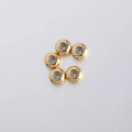 Detailed view of 8mm gold stainless steel stopper beads with silicone inner ring - 8mm / Gold
