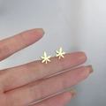 Minimalist 925 sterling silver leaf stud earrings with a bright golden metal finish - Maple Leaf / Gold