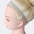 Light grey elastic silicone yoga sports headband shown on model in studio profile view - Gray