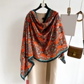 Orange paisley faux silk scarf with black contrast border draped on a beige coat - 180*88cm / Red