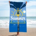 Blue microfiber beach towel with Summer Paradise palm tree print shown on a sunny beach - B48-Summer Paradise Blue Palm