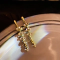 Exaggerated golden drop earrings with marquise crystals and shimmering light effect - Rhinestone Tassel with Silver Pin
