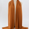 Elegant caramel orange chiffon hijab scarf for women with soft drapes and rolled edges - 148