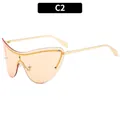 Cat eye rimless metal cyber sunglasses with orange gradient lenses and gold temples - Champagne