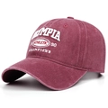 Detailed close-up of retro washed burgundy baseball cap with white athletic embroidery - Burgundy