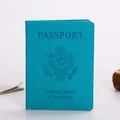 Turquoise PU leather passport holder featuring embossed US emblem and white stitching - Lake Blue