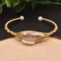 Golden handmade wire-wrapped bracelet with large pink baroque pearl and small white gems - Jade Openwork Pink Purple Style
