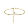 Detailed macro shot of S925 sterling silver gold bracelet with pearl and zircons - Gold