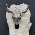 Macro shot of a silver bull skull pendant with metallic finish on a white crystal cluster - No.5 Full Silver Color