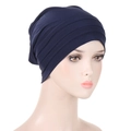 Navy blue pleated headwrap beanie for women displayed on a clean white mannequin head - Navy Blue
