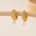 Macro shot of gold-plated pearl earrings with micro-set zircon on elegant beige base - Segmented Micropave Pearl Buckle (EH412009)