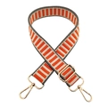 Detail of adjustable orange and beige striped fabric bag strap with gold metal buckles - Orange
