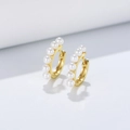 Classic gold plated 925 silver hoop earrings with round white pearls on white background - Gold