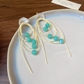 Vintage style drop earrings with beige cord and light blue beads on a white ceramic tray - 10# Silver Earring Post Shell Glass Multi-layer Tassel Earrings
