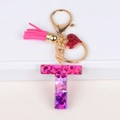 Pink glitter resin letter T keychain with fuchsia tassel and heart charm in gold finish - Letter T