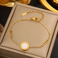 Detail of 18K gold stainless steel bracelet with Roman numeral pendant and shell inlay - Gold Roman Numerals MOP Disc (FSY708)