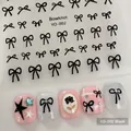 Adhesive nail art stickers featuring black bowknot designs with gold accents model YO-002 - YO-002 Black