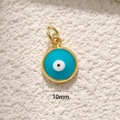 Close-up of 10mm round blue evil eye pendant with gold plating for jewelry DIY - A0274 Gold Lake Blue Eye 10mm