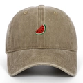 Close-up of the detailed watermelon slice embroidery on a khaki washed cotton baseball cap - One Size / Khaki