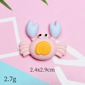 Detailed view of pink and blue resin crab charm measuring 2.4x2.9cm for DIY projects - Pink Crab
