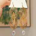 Boucles d'oreilles dorées ovales creuses avec des pendentifs en cristal facetté - Cuivre Plaqué Or (Avec Tige en Argent S925) / Doré