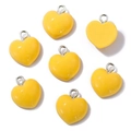 Detail showing multiple yellow resin heart charms with silver metal hanging loops - Heart with Loop / Yellow