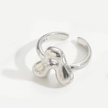 Polished silver adjustable ring featuring a unique stylized clover letter design - Letter A Style