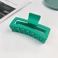 Close-up of a 13cm matte turquoise shark hair claw clip in a hollow rectangular shape - 13cm Extra Large Square Claw-Lake Green