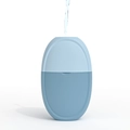 Blue dual-tone facial ice roller mold being filled with water for skin massage - Light Oval - Blue