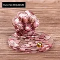 Hars kattenpoot ornament met roze rhodoniet kristallen en een gouden decoratieve kraal - Rhodoniet