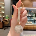 Sparkling crystal ball car keychain with golden ring and rhinestones for women - White