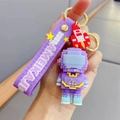 Violetter Pixel-Astronaut Schlüsselanhänger mit Gummiband und kleinem Raketenanhänger - Pixel Astronaut--Lila