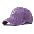 Detailed close-up of the white heart embroidery on a purple washed cotton baseball cap - Adjustable / Purple