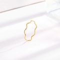 Minimalist gold wavy textured titanium steel ring on a white surface with shadows - US 5 / Gold