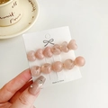 Two-piece pink marble heart and round bead hair clips set on white display card - Pink