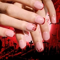 Close-up of nude pink French manicure with blood drip patterns for Halloween vibes - Halloween Blood Drip Bat