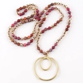 Detail of beaded necklace with semi-precious stones and golden double circle pendant - Pink Red Series / Golden Double Ring