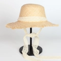 Women's summer straw hat with lace bow, wide brim, and fringe edges for beach sun protection - Adjustable / Light Beige