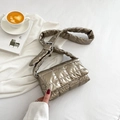 Golden quilted puffer crossbody bag with stitched square pattern and adjustable strap - Gold