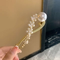 Golden pearl hair clip featuring a twisted metal frame and elegant floral pearl patterns - Five-Flower Pearl Twist Clip - Gold