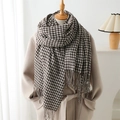 Houndstooth cashmere-feel scarf in brown and beige with tassels on a mannequin - 210cmX70cm (Including Tassels) / Coffee