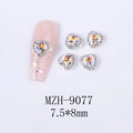Macro detail of aurora crystal heart nail charms with white rhinestones, size 7.5x8mm - Heavenly Light Heart Silver Base (MZH-9077)
