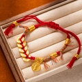 Close-up of handmade red string bracelet with gold ancient coins in a wooden box - L269-5 Prosperous Wealth