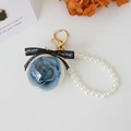 Preserved blue rose keychain with faux pearl chain and gold hook for handbag - Gray Blue