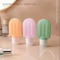 Three cute popsicle shaped silicone travel bottles in orange, pink, and green colors - Popsicle Shape / Mixed Colors / 90ML / 3pcs Set