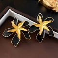 Detailed close-up of vintage flower earrings in gold and black on leather texture - Black Double Layer Flower (16# Silver Pin)