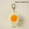 Realistic PVC boiled egg keychain with orange yolk and silver metal ring accessory - Half Soft-boiled Egg - Lobster Clasp