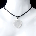 White crystal heart pendant necklace with black cord on a professional mannequin - White Crystal